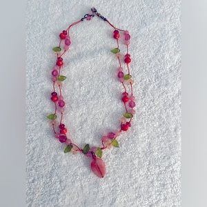 Glass bead necklace. Green leaves, pink glass and stone beads. 18” long.